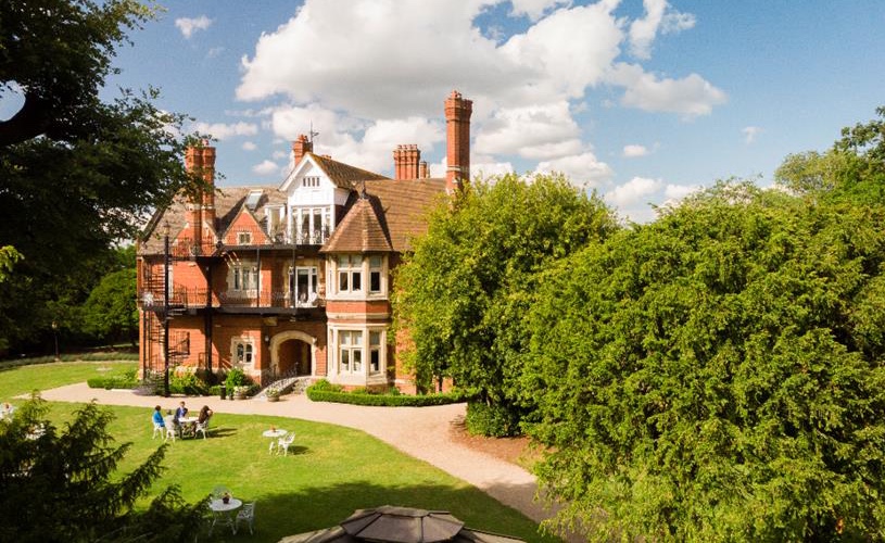 View of Berwick Lodge and surrounding lawn and trees